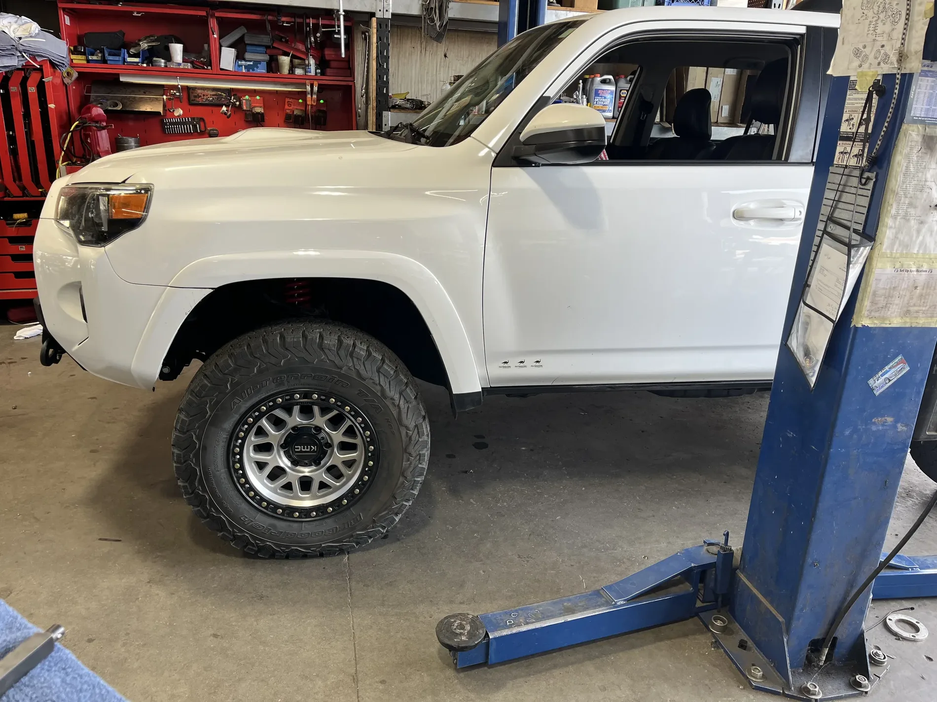 Off-road vehicle being worked on inside the shop